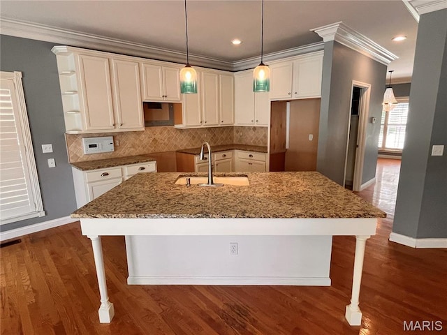 114 Cloverleaf Meadows Ct, Ofallon, MO 63366 - kitchen featuring a center island with sink, crown molding, stone countertops, white cabinetry, and tasteful backsplash