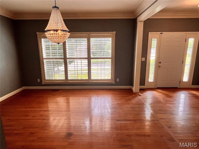 114 Cloverleaf Meadows Ct, Ofallon, MO 63366 - foyer featuring healthy amount of natural light, wood finished floors, a chandelier, and crown molding