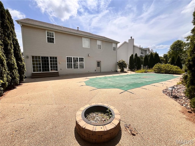 114 Cloverleaf Meadows Ct, Ofallon, MO 63366 - view of pool with a patio area, a covered pool, and an outdoor fire pit