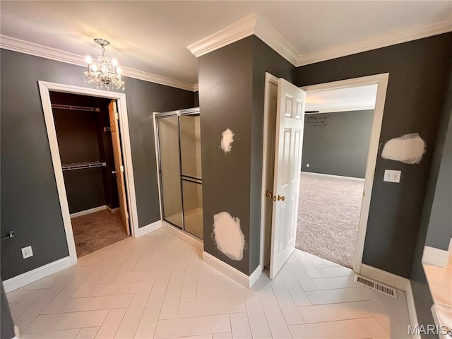 114 Cloverleaf Meadows Ct, Ofallon, MO 63366 - bathroom featuring a shower stall, a chandelier, a spacious closet, and crown molding