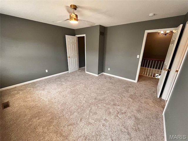 114 Cloverleaf Meadows Ct, Ofallon, MO 63366 - unfurnished bedroom with carpet floors, a chandelier, and a ceiling fan