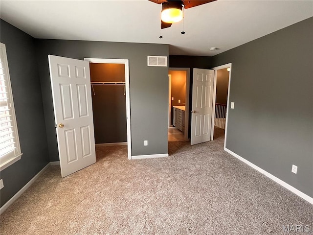 114 Cloverleaf Meadows Ct, Ofallon, MO 63366 - unfurnished bedroom with a walk in closet, carpet, a closet, and ceiling fan