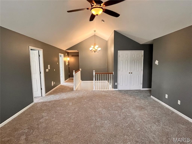 114 Cloverleaf Meadows Ct, Ofallon, MO 63366 - carpeted spare room with vaulted ceiling, ceiling fan, and a chandelier