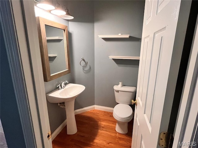 114 Cloverleaf Meadows Ct, Ofallon, MO 63366 - half bathroom featuring wood finished floors and toilet