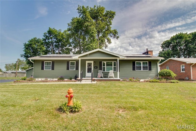 109 Hawbrook Pl, Jerseyville, IL 62052 - single story home with covered porch, solar panels, a front yard, and a chimney