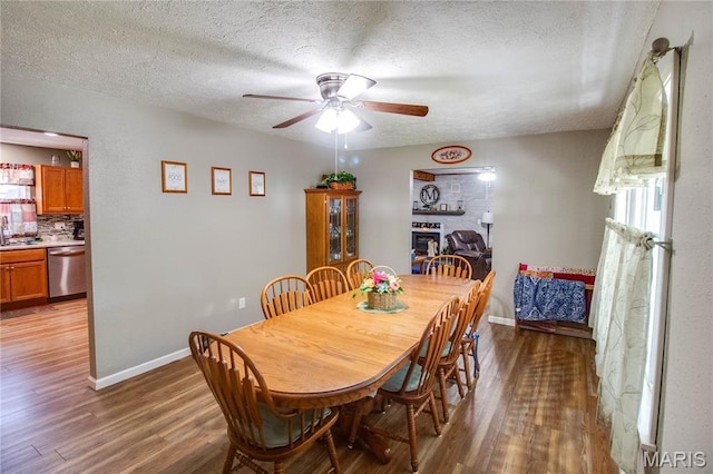 109 Hawbrook Pl, Jerseyville, IL 62052 - dining area with wood finished floors, a textured ceiling, and a ceiling fan