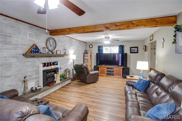 109 Hawbrook Pl, Jerseyville, IL 62052 - living area with ceiling fan, light wood-style flooring, beam ceiling, a textured ceiling, and brick wall