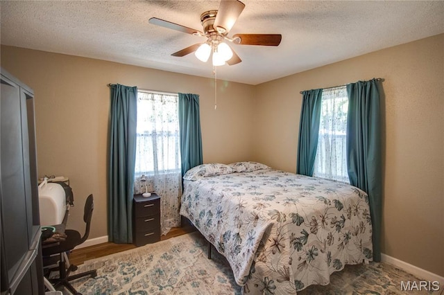 109 Hawbrook Pl, Jerseyville, IL 62052 - bedroom with a ceiling fan, wood finished floors, and a textured ceiling