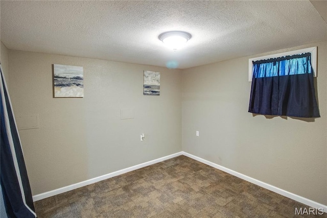 109 Hawbrook Pl, Jerseyville, IL 62052 - unfurnished room with a textured ceiling and dark colored carpet