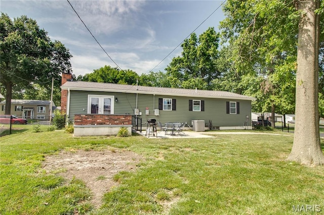 109 Hawbrook Pl, Jerseyville, IL 62052 - back of house with french doors, a chimney, and a patio area