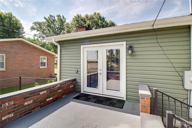 109 Hawbrook Pl, Jerseyville, IL 62052 - view of exterior entry with french doors and a chimney