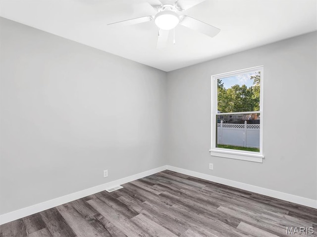 1505 Cypress Dr, Pacific, MO 63069 - spare room featuring dark wood-style floors and a ceiling fan