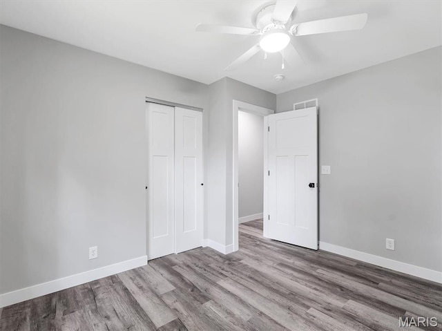 1505 Cypress Dr, Pacific, MO 63069 - unfurnished bedroom with wood finished floors, a closet, and a ceiling fan