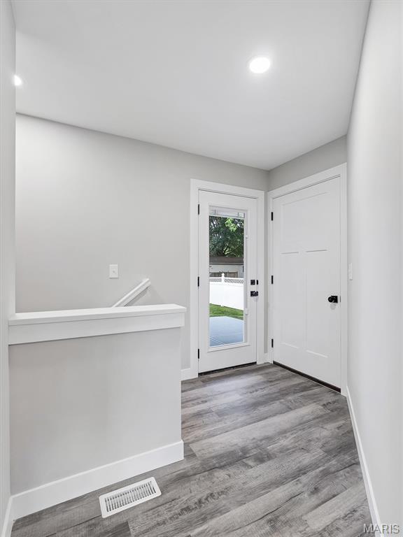 1505 Cypress Dr, Pacific, MO 63069 - foyer entrance with wood finished floors and recessed lighting