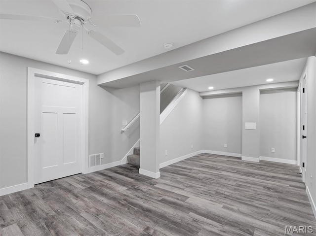 1505 Cypress Dr, Pacific, MO 63069 - finished below grade area with wood finished floors, stairway, recessed lighting, and ceiling fan