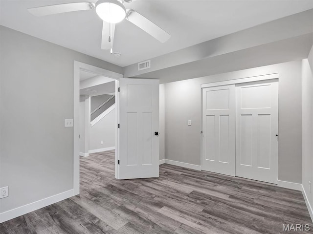1505 Cypress Dr, Pacific, MO 63069 - unfurnished bedroom featuring wood finished floors, a closet, and ceiling fan