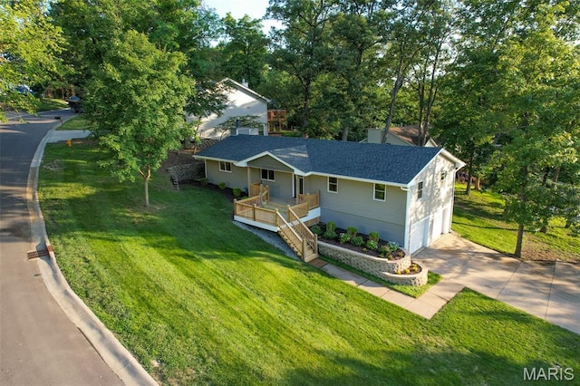 525 Oak Hill Dr, Lake St Louis, MO 63367 - ranch-style house featuring driveway, a garage, a front yard, covered porch, and a shingled roof
