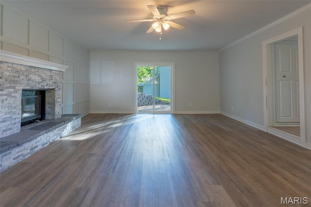 525 Oak Hill Dr, Lake St Louis, MO 63367 - unfurnished living room with crown molding, a ceiling fan, dark wood-type flooring, and a fireplace