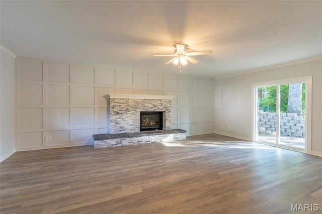 525 Oak Hill Dr, Lake St Louis, MO 63367 - unfurnished living room with a decorative wall, a ceiling fan, crown molding, wood finished floors, and a fireplace