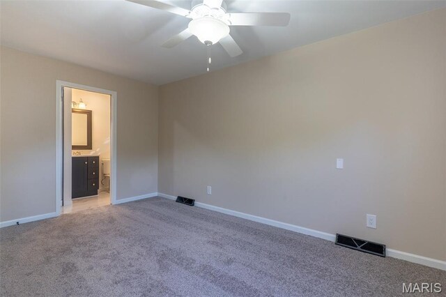 525 Oak Hill Dr, Lake St Louis, MO 63367 - unfurnished bedroom with light carpet, a ceiling fan, and ensuite bathroom