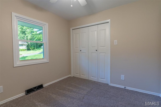 525 Oak Hill Dr, Lake St Louis, MO 63367 - unfurnished bedroom with carpet flooring, a closet, and a ceiling fan