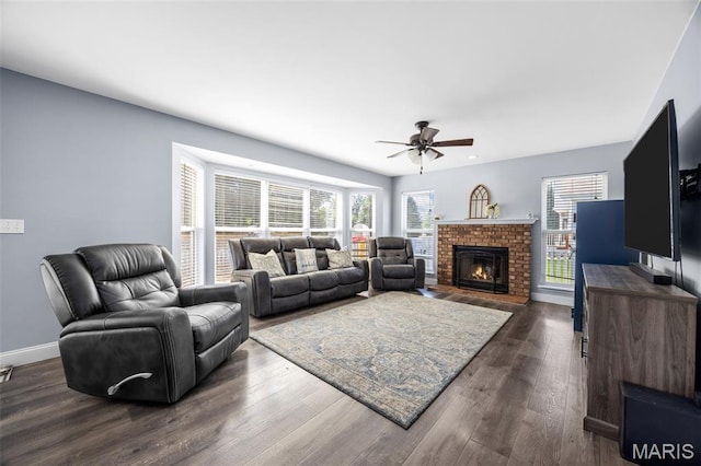 105 Royallmanor Ln, Ofallon, MO 63368 - living area featuring a ceiling fan, healthy amount of natural light, dark wood-style floors, and a brick fireplace
