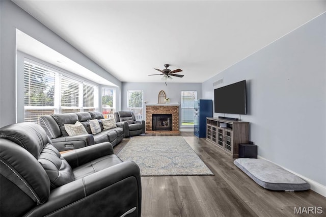 105 Royallmanor Ln, Ofallon, MO 63368 - living area with ceiling fan, wood finished floors, and a brick fireplace