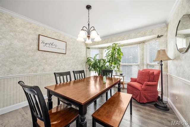 105 Royallmanor Ln, Ofallon, MO 63368 - dining area with a chandelier, wood finished floors, ornamental molding, wallpapered walls, and wainscoting