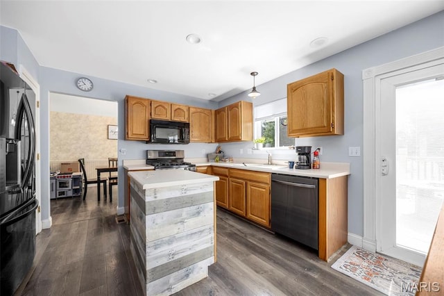 105 Royallmanor Ln, Ofallon, MO 63368 - kitchen featuring dishwasher, black microwave, stainless steel range with gas stovetop, fridge with ice dispenser, and light countertops