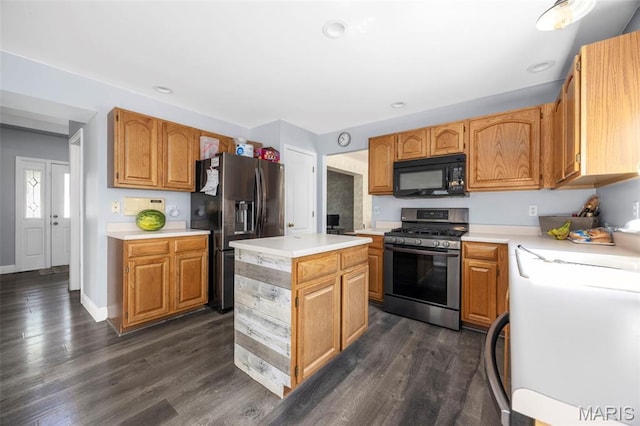 105 Royallmanor Ln, Ofallon, MO 63368 - kitchen with appliances with stainless steel finishes, light countertops, a center island, dark wood-style floors, and recessed lighting