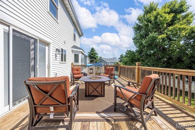 105 Royallmanor Ln, Ofallon, MO 63368 - wooden deck with an outdoor fire pit