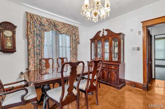 5447 Claxton Ave, Saint Louis, MO 63120 - dining space featuring baseboards and a chandelier