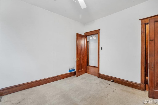 5447 Claxton Ave, Saint Louis, MO 63120 - empty room with light colored carpet and a ceiling fan