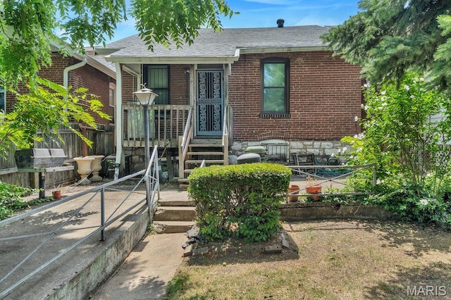 5447 Claxton Ave, Saint Louis, MO 63120 - view of front facade with brick siding and roof with shingles