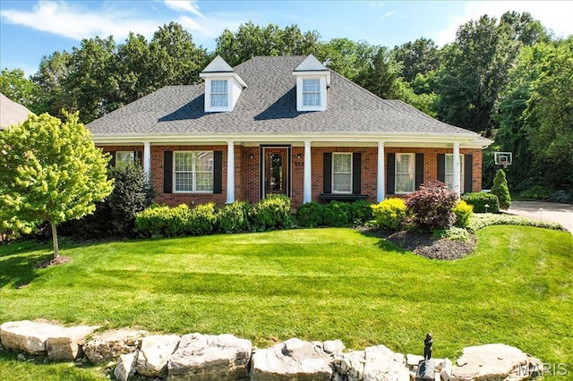 512 Overlook Terrace Ct, Eureka, MO 63025 - cape cod-style house with a front yard, brick siding, a porch, and a shingled roof