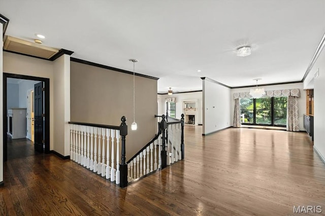 512 Overlook Terrace Ct, Eureka, MO 63025 - hallway featuring ornamental molding, wood finished floors, plenty of natural light, an upstairs landing, and recessed lighting