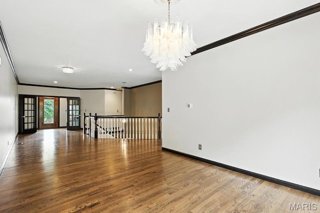 512 Overlook Terrace Ct, Eureka, MO 63025 - spare room featuring ornamental molding, wood finished floors, and a chandelier