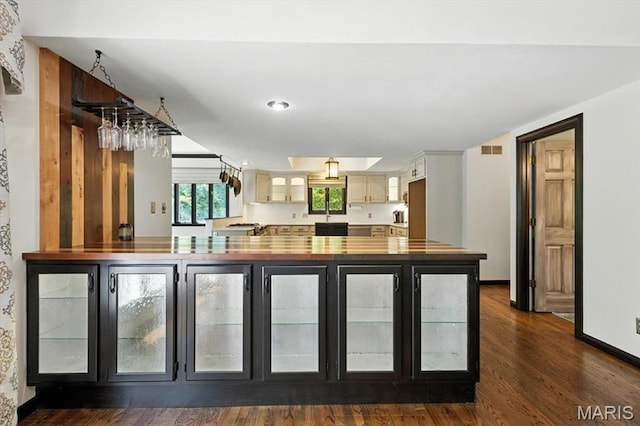 512 Overlook Terrace Ct, Eureka, MO 63025 - kitchen with wooden counters, dark wood-style flooring, and glass insert cabinets