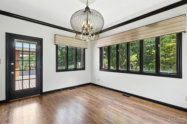512 Overlook Terrace Ct, Eureka, MO 63025 - spare room featuring a chandelier, ornamental molding, and wood finished floors