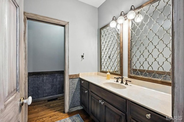 512 Overlook Terrace Ct, Eureka, MO 63025 - bathroom featuring vanity, wainscoting, and wood finished floors