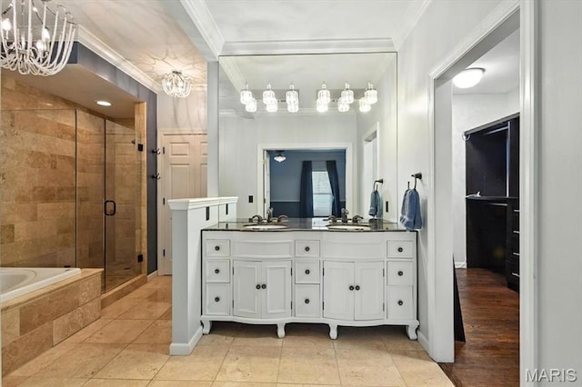 512 Overlook Terrace Ct, Eureka, MO 63025 - full bath with a chandelier, a stall shower, crown molding, double vanity, and a garden tub