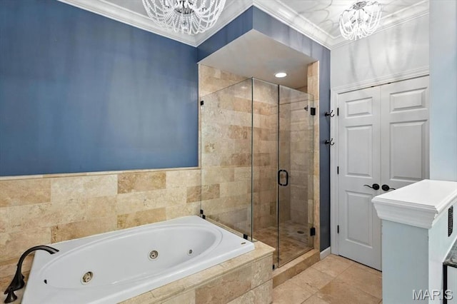 512 Overlook Terrace Ct, Eureka, MO 63025 - full bath featuring a chandelier, a whirlpool tub, a stall shower, ornamental molding, and tile patterned flooring