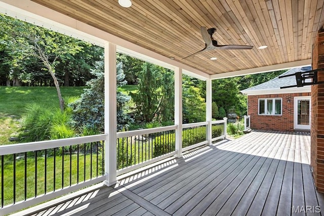 512 Overlook Terrace Ct, Eureka, MO 63025 - wooden deck with ceiling fan, a lawn, and view of scattered trees