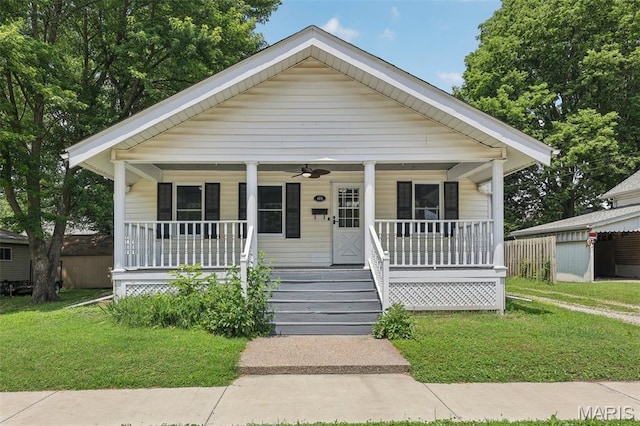 413 E Beach St, Litchfield, IL 62056 - bungalow-style home featuring a porch, a front lawn, and ceiling fan