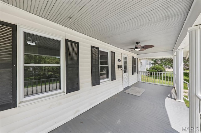 413 E Beach St, Litchfield, IL 62056 - wooden porch with a ceiling fan