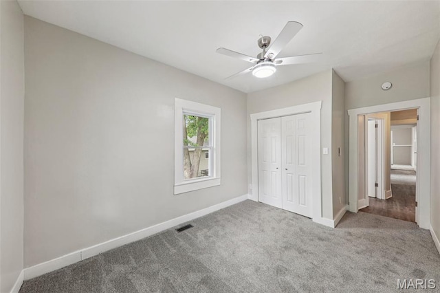 413 E Beach St, Litchfield, IL 62056 - unfurnished bedroom with carpet, a closet, and ceiling fan