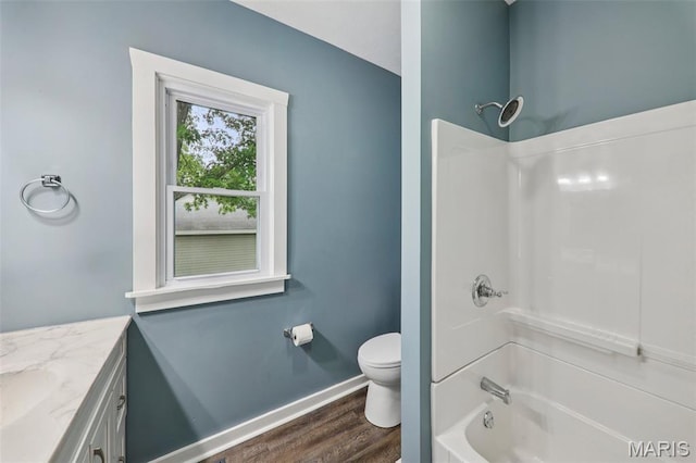 413 E Beach St, Litchfield, IL 62056 - bathroom with vanity, wood finished floors, and shower / bathtub combination