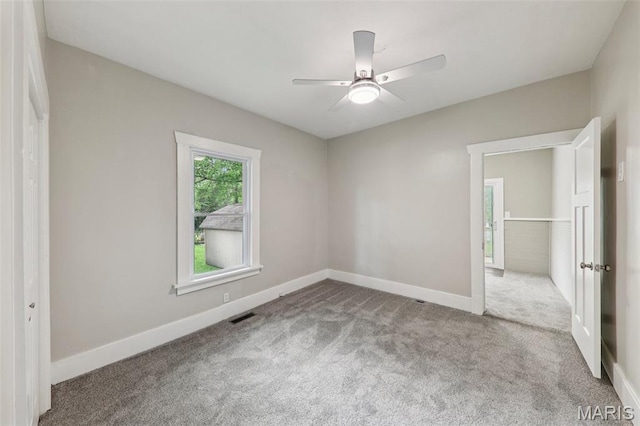 413 E Beach St, Litchfield, IL 62056 - unfurnished bedroom featuring carpet and a ceiling fan