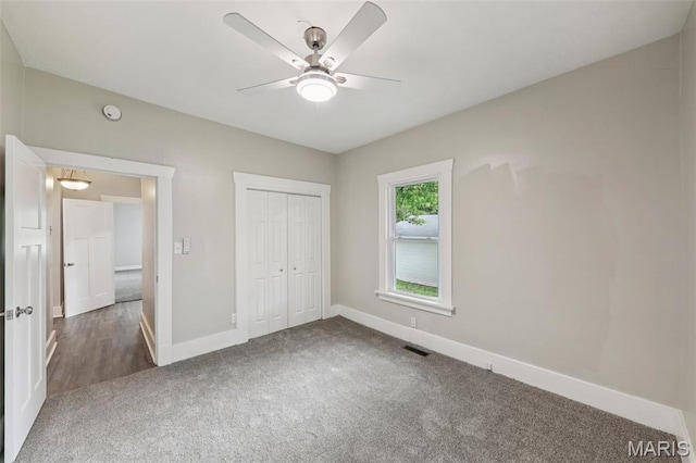 413 E Beach St, Litchfield, IL 62056 - unfurnished bedroom featuring carpet flooring, a closet, and a ceiling fan