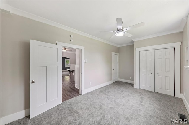 413 E Beach St, Litchfield, IL 62056 - unfurnished bedroom featuring carpet flooring, ornamental molding, and a ceiling fan